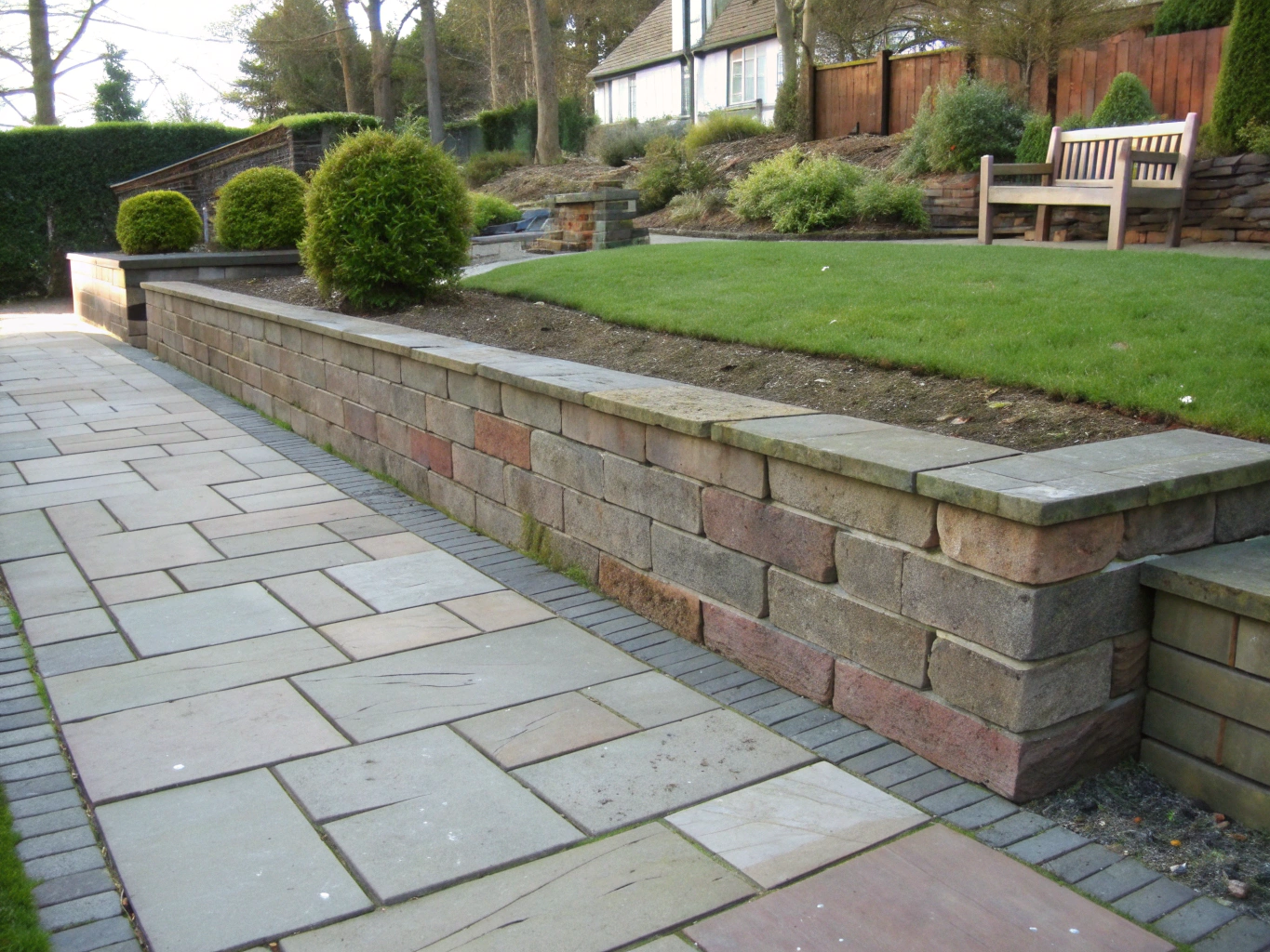 Structural retaining wall with natural stone texture